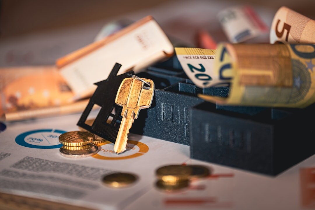 Stack of inheritance documents and a house key on a desk